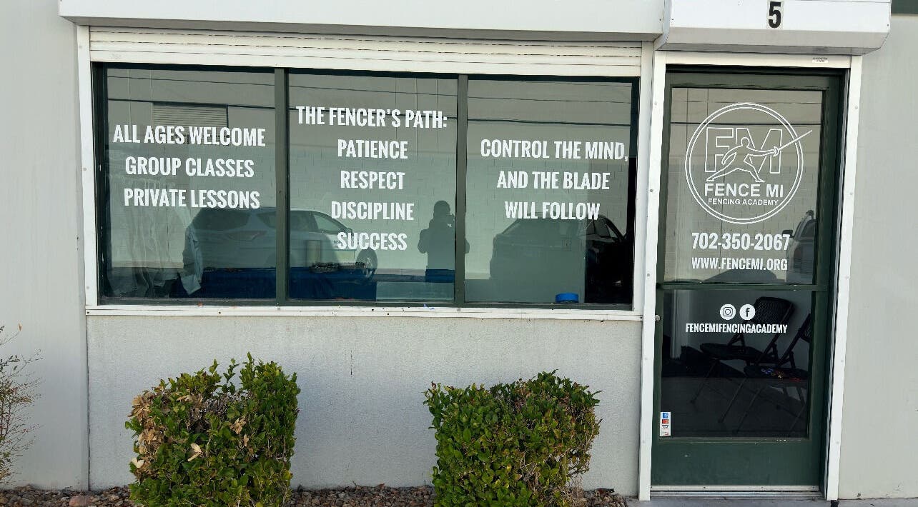 Entrance of Fence MI Fencing Academy in Las Vegas, Nevada, US with welcome and class information.