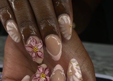 Elegant floral nail art by Nailsbybodgyal in Ottawa, Ontario, CA, showcasing detailed flower designs.