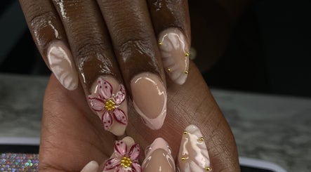 Elegant floral nail art by Nailsbybodgyal in Ottawa, Ontario, CA, showcasing detailed flower designs.