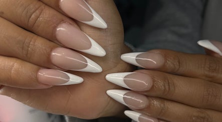 Stylish French manicure at Nailsbybodgyal in Ottawa, Ontario, CA, showcasing elegant pointed nail tips.