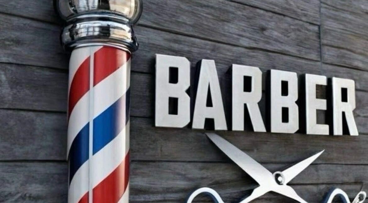 Símbolo de barbería tradicional frente a Tortolero barber en Bogotá, D.c., Bogotá, D.c., CO.