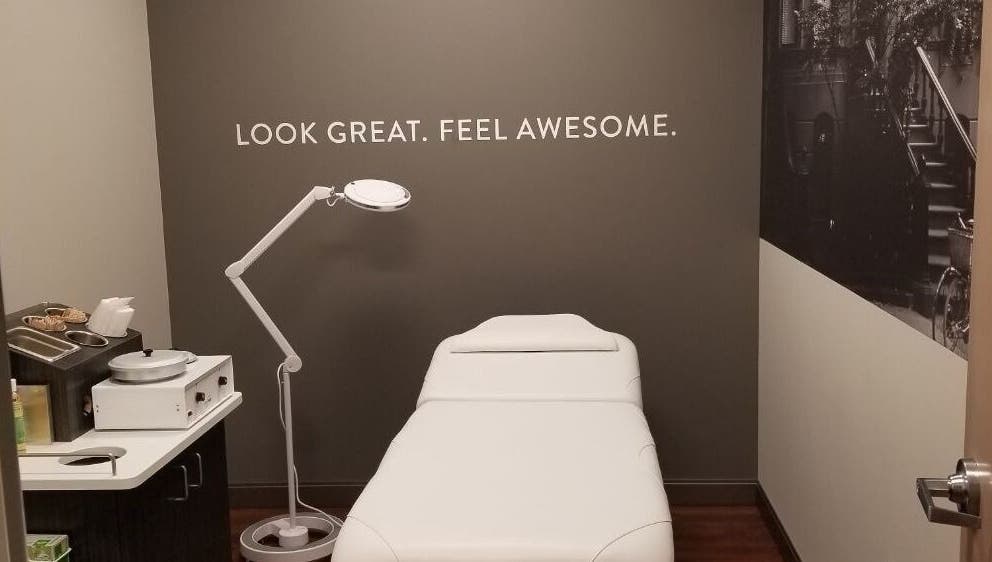 Treatment room at TheWaxBar.LA in Cudahy, California, US with a spa bed and stylish decor.
