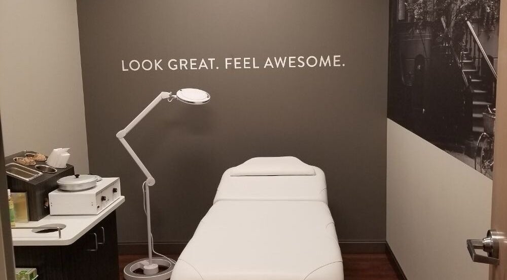 Treatment room at TheWaxBar.LA in Cudahy, California, US with a spa bed and stylish decor.
