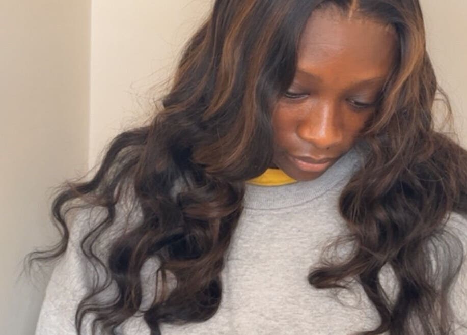 Sleek hairstyle at Layedituk_ in Manchester, England, GB, featuring glossy, cascading waves.