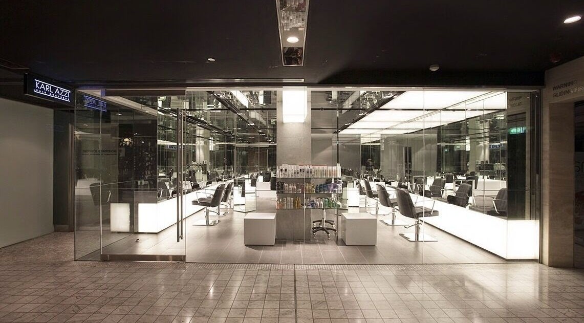 Sleek interior of KARL AZZI Hairdressers - Westfield Sydney, Sydney, New South Wales, AU showcasing modern design.