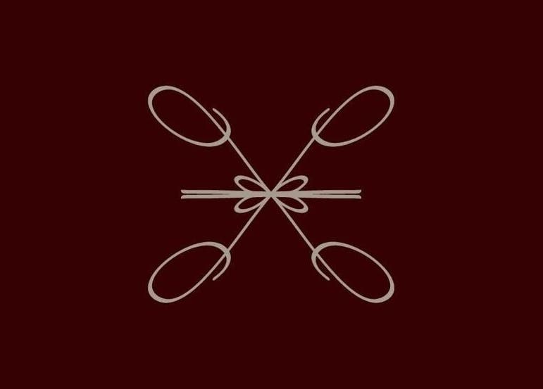 Elegant design at Le Lumiere Spa in SA, featuring intricate, symmetrical patterns on a dark backdrop.