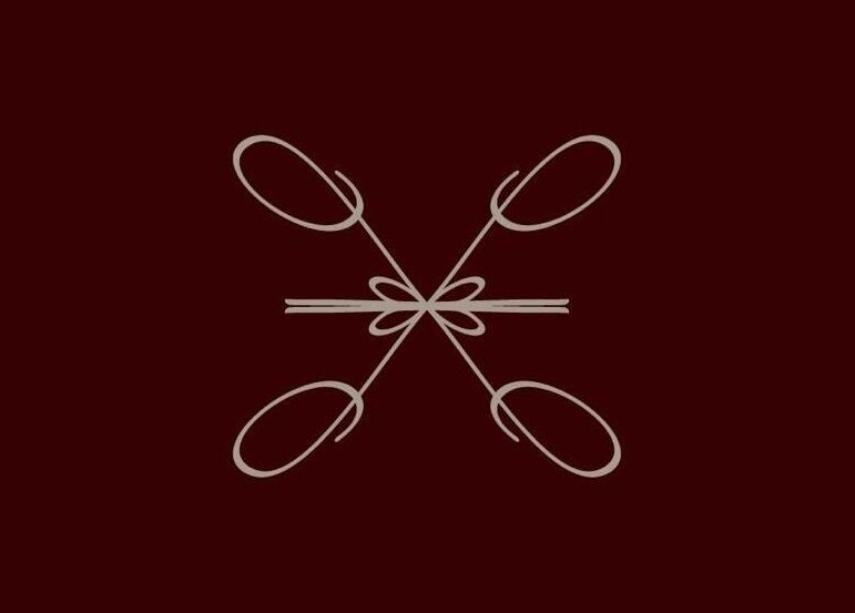 Elegant design at Le Lumiere Spa in SA, featuring intricate, symmetrical patterns on a dark backdrop.