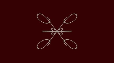 Elegant design at Le Lumiere Spa in SA, featuring intricate, symmetrical patterns on a dark backdrop.