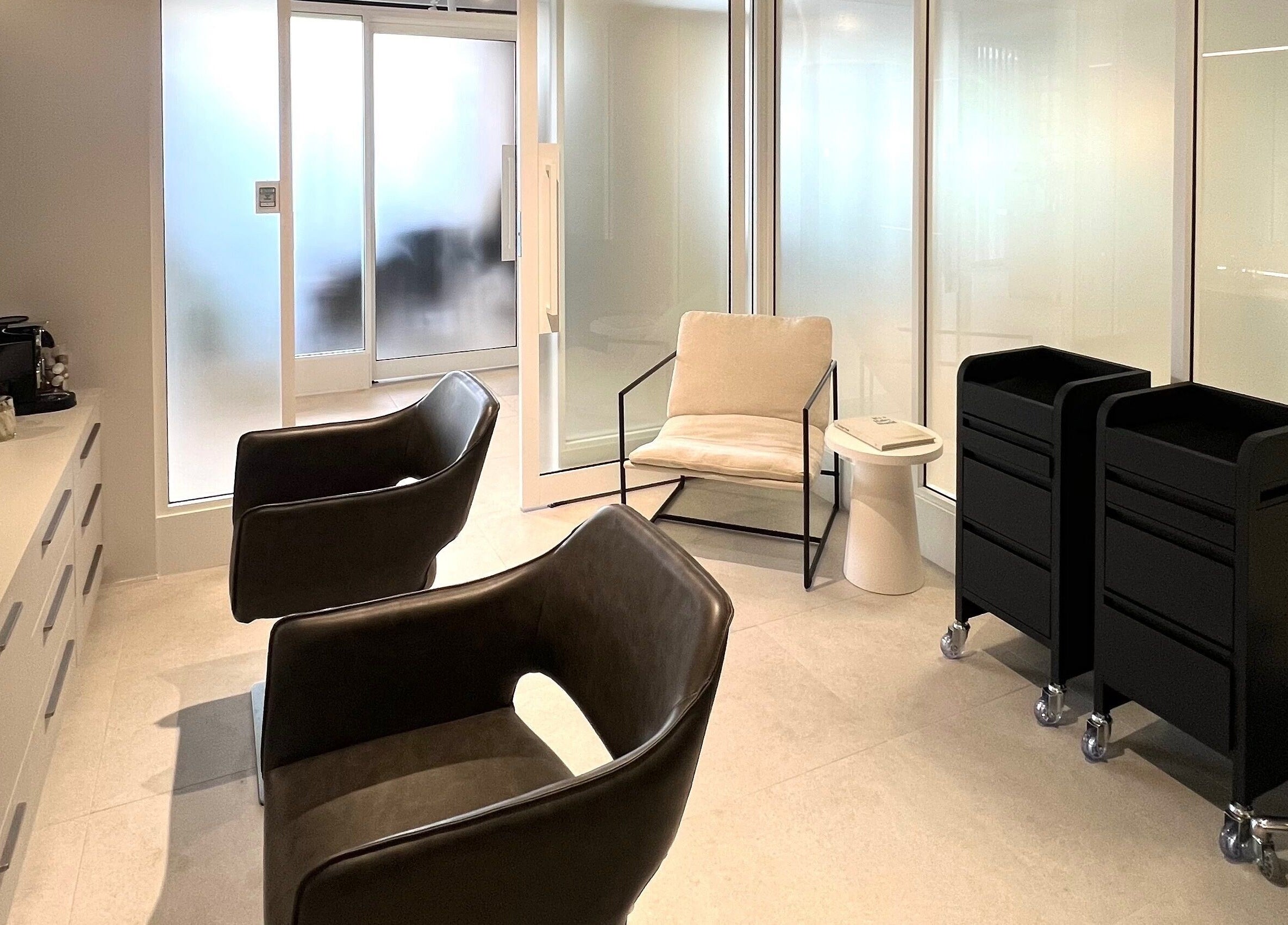 Modern salon interior of Kove Suite, Innaloo, Western Australia, AU, with sleek chairs and stylish decor.