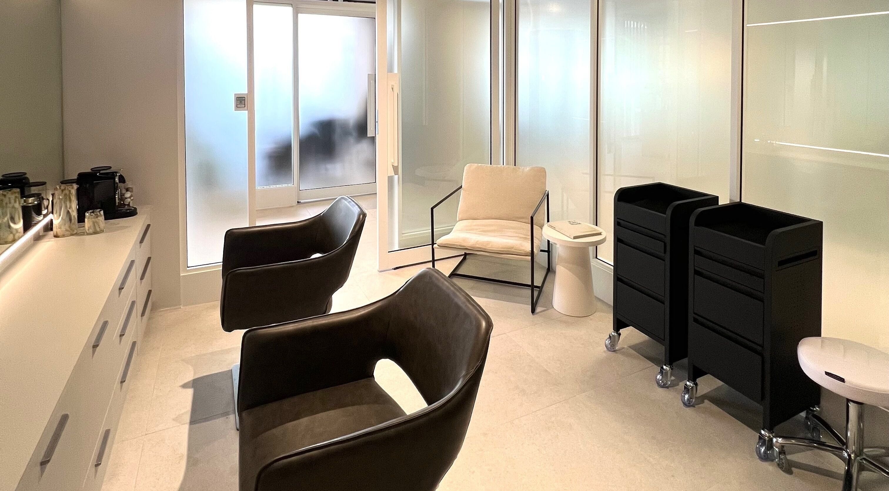 Modern salon interior of Kove Suite, Innaloo, Western Australia, AU, with sleek chairs and stylish decor.