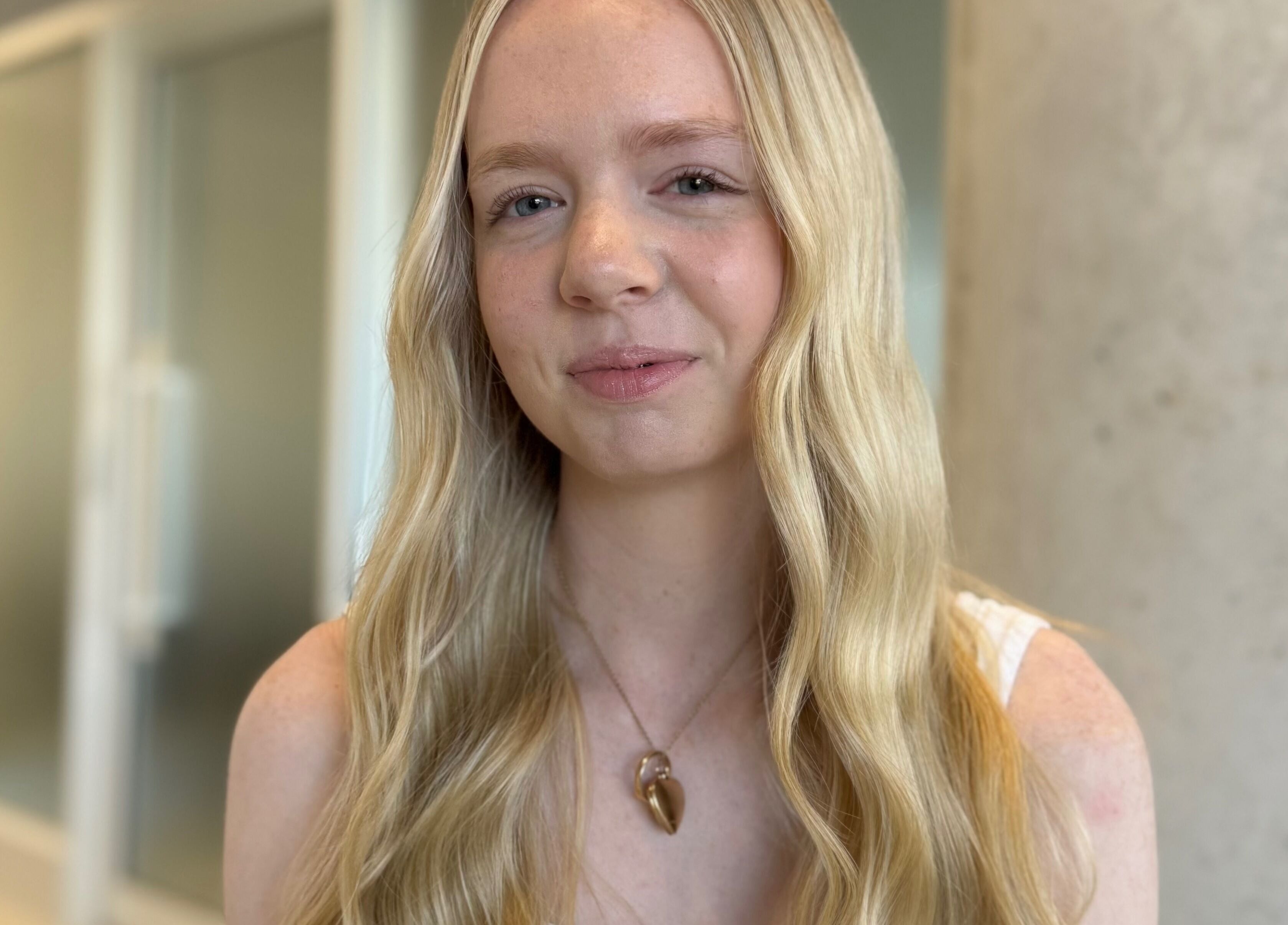 Portrait of a person with wavy hair at Kove Suite, Innaloo, Western Australia, AU.