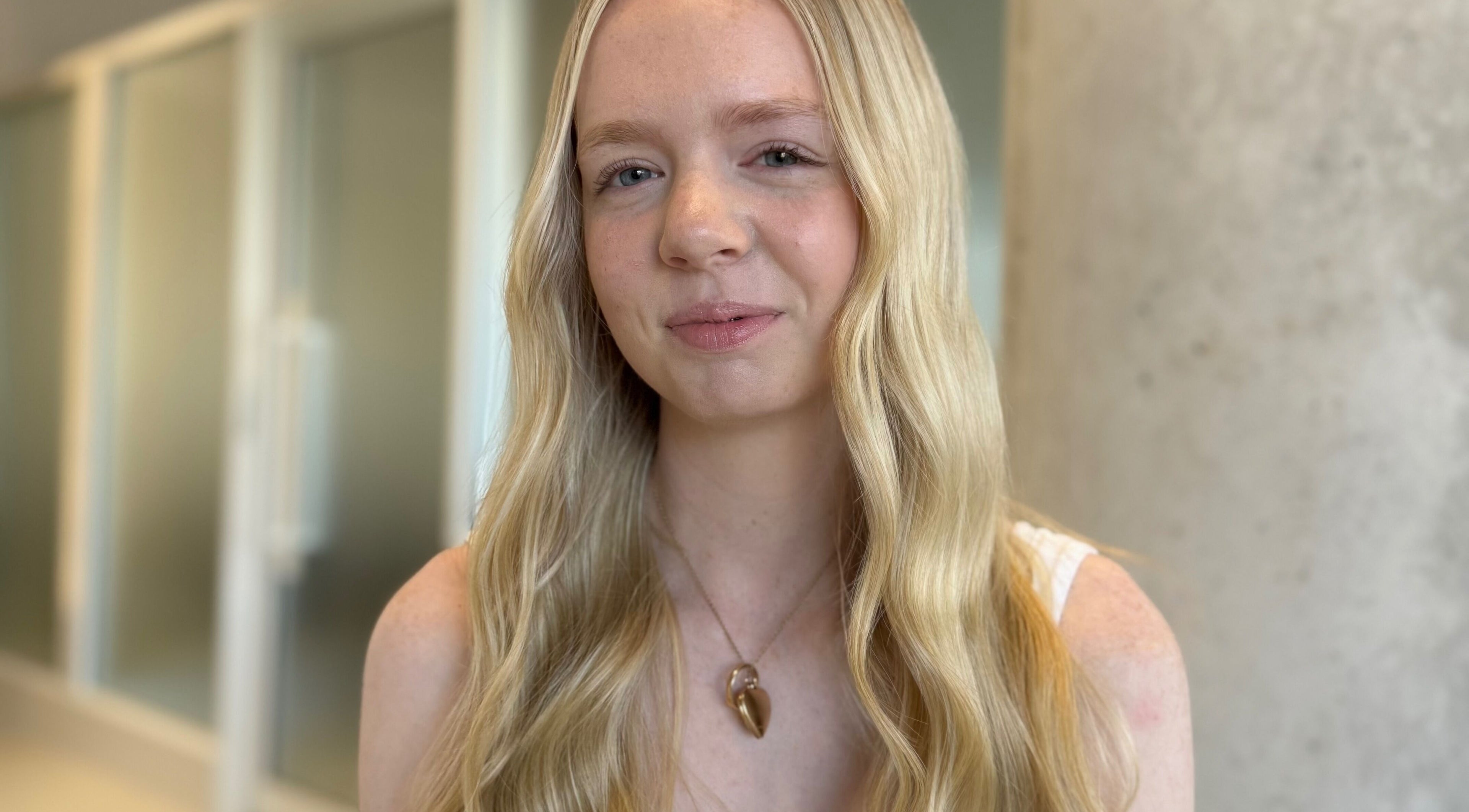 Portrait of a person with wavy hair at Kove Suite, Innaloo, Western Australia, AU.