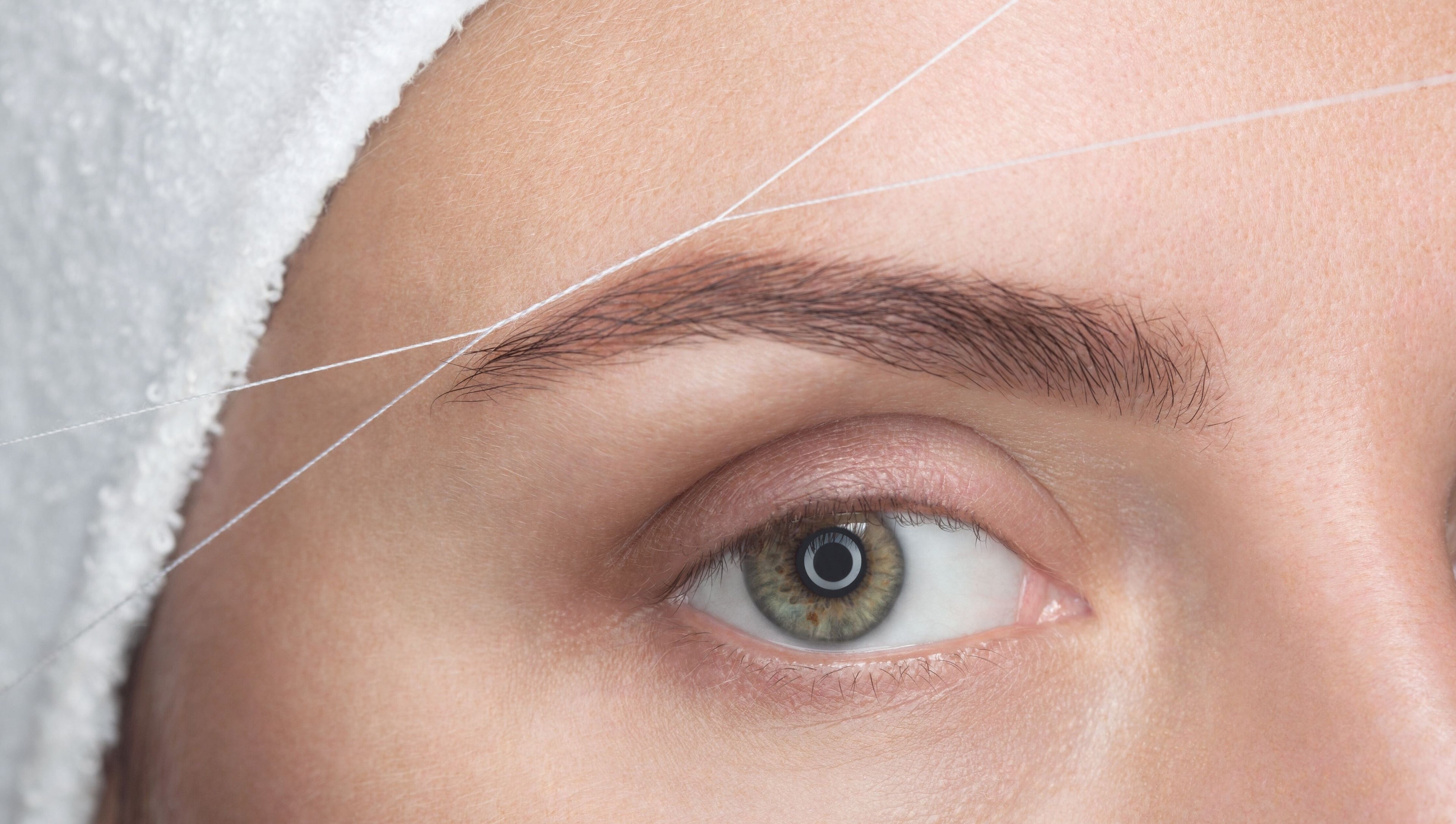Eyebrow threading service at Luxe Aura Beauty & Brows, Melbourne, Victoria, AU.