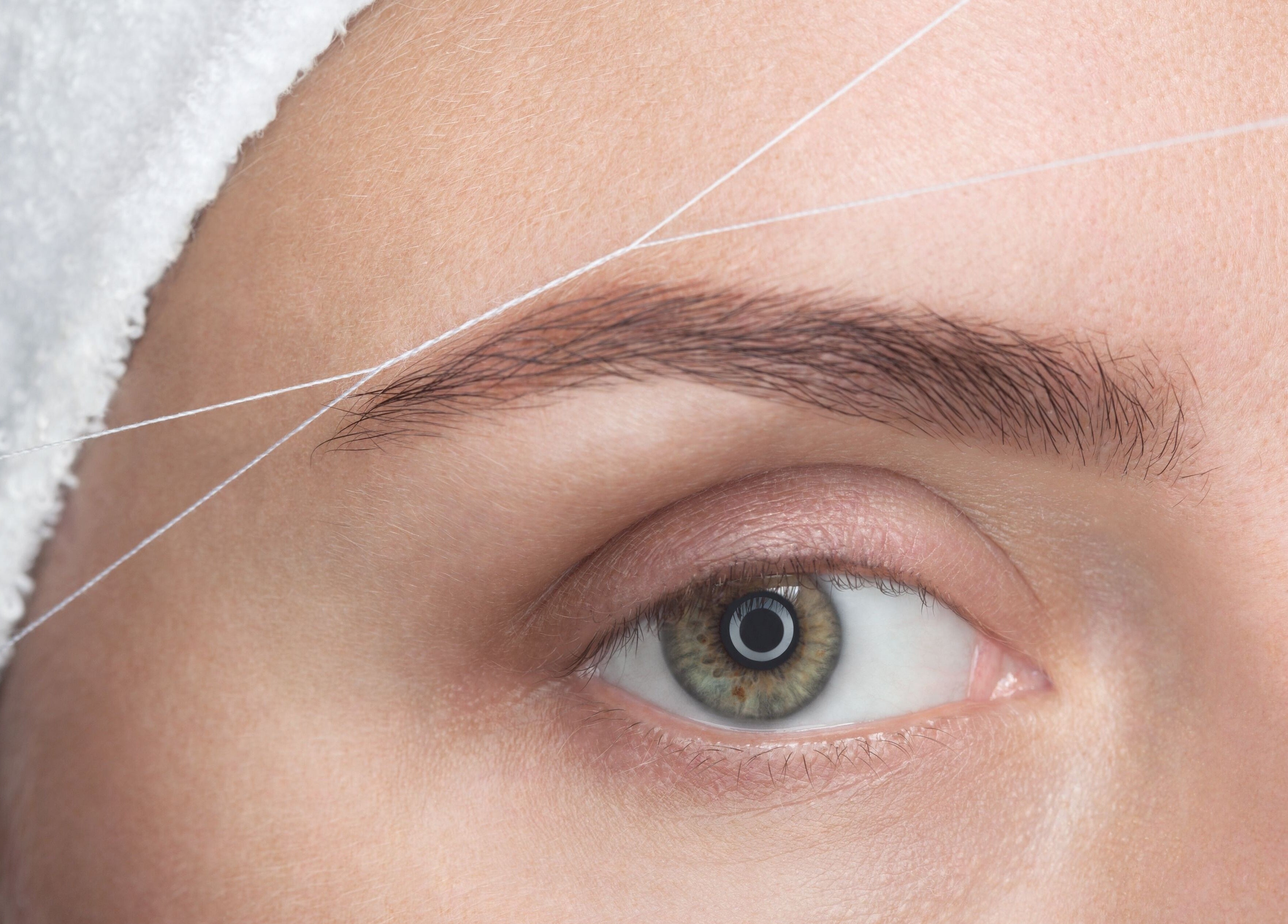 Eyebrow threading service at Luxe Aura Beauty & Brows, Melbourne, Victoria, AU.
