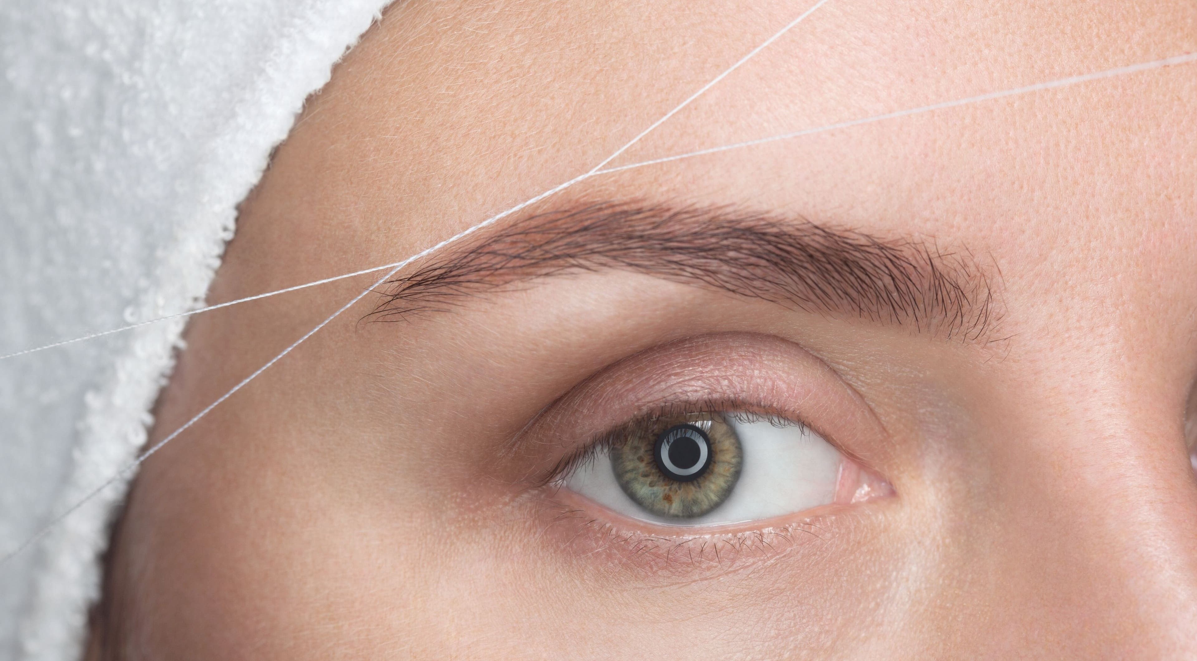 Eyebrow threading service at Luxe Aura Beauty & Brows, Melbourne, Victoria, AU.