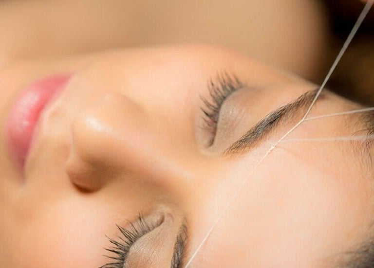 Expert eyebrow threading at Luxe Aura Beauty & Brows, Melbourne, Victoria, AU, enhancing natural beauty.