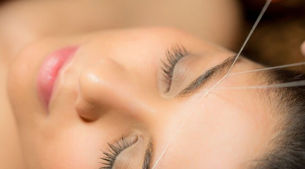 Expert eyebrow threading at Luxe Aura Beauty & Brows, Melbourne, Victoria, AU, enhancing natural beauty.