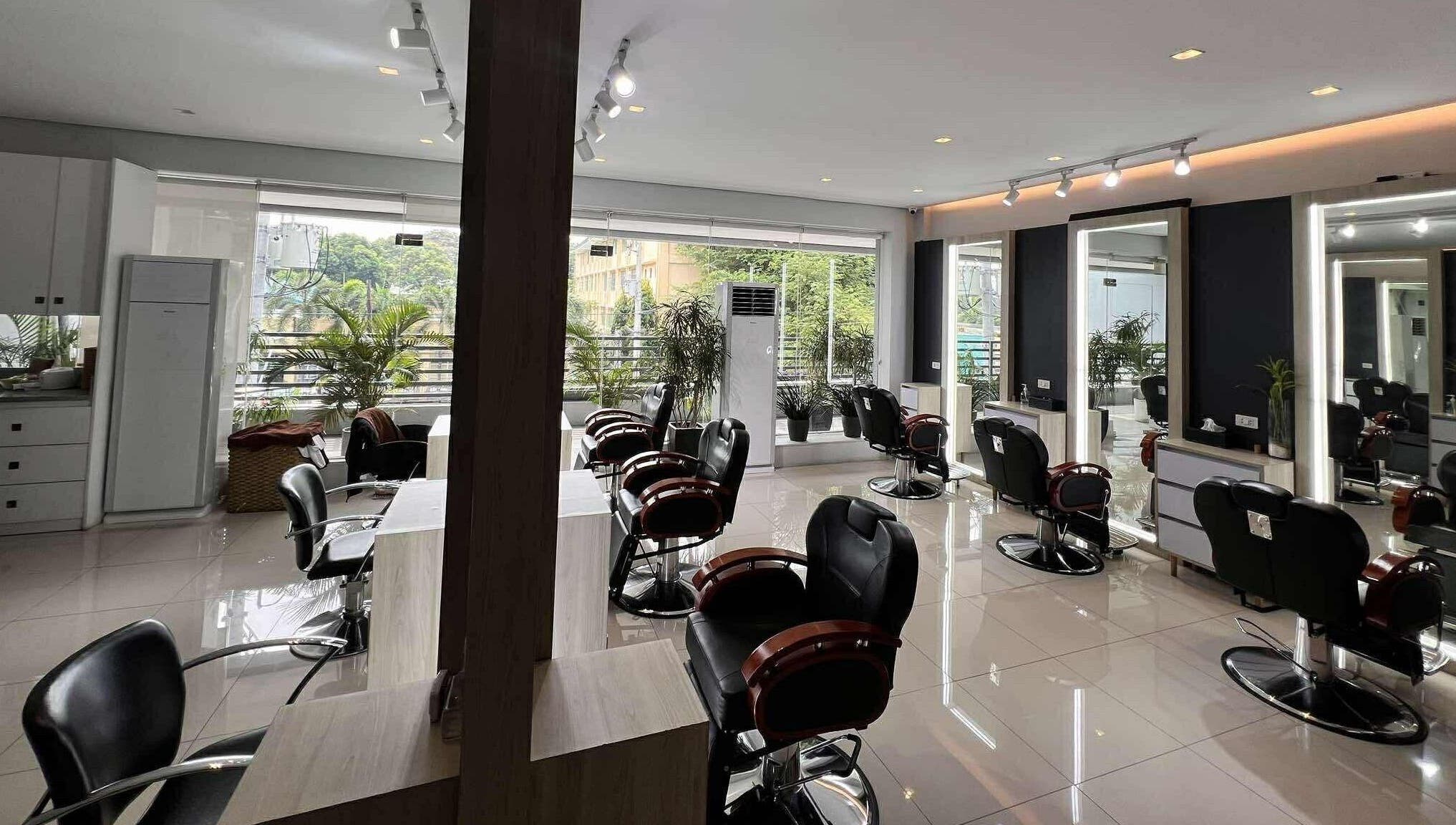 Modern seating in Behind The Chair Salon | Quezon City Branch, Metro Manila, PH with stylish decor and natural light.