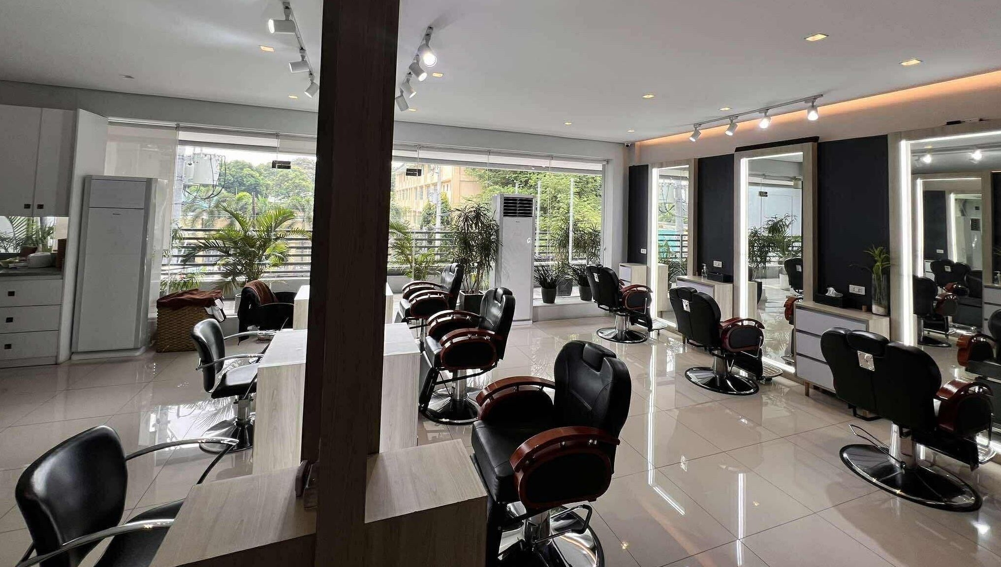 Modern seating in Behind The Chair Salon | Quezon City Branch, Metro Manila, PH with stylish decor and natural light.