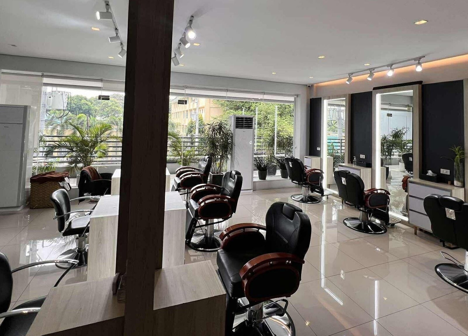 Modern seating in Behind The Chair Salon | Quezon City Branch, Metro Manila, PH with stylish decor and natural light.