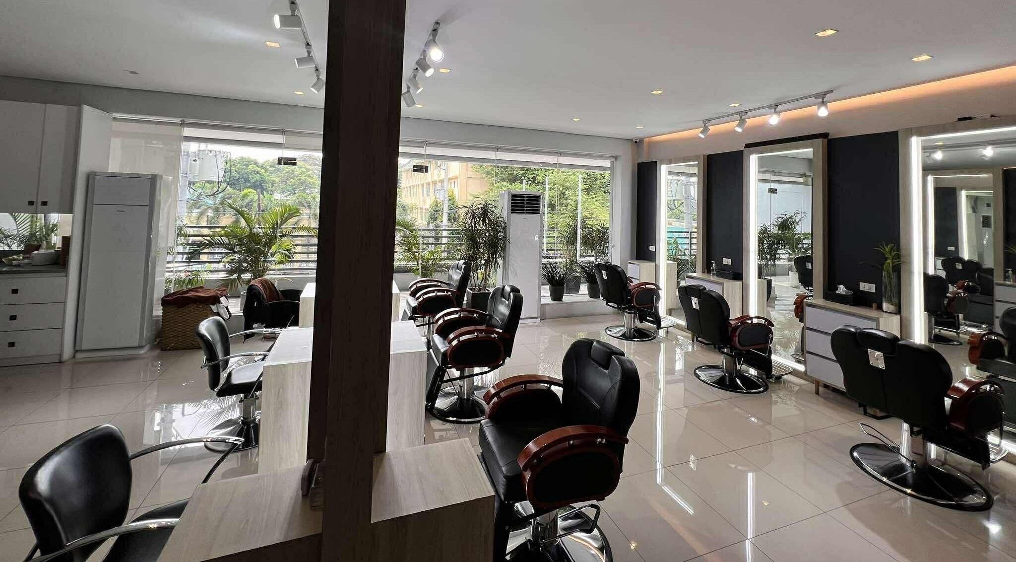 Modern seating in Behind The Chair Salon | Quezon City Branch, Metro Manila, PH with stylish decor and natural light.
