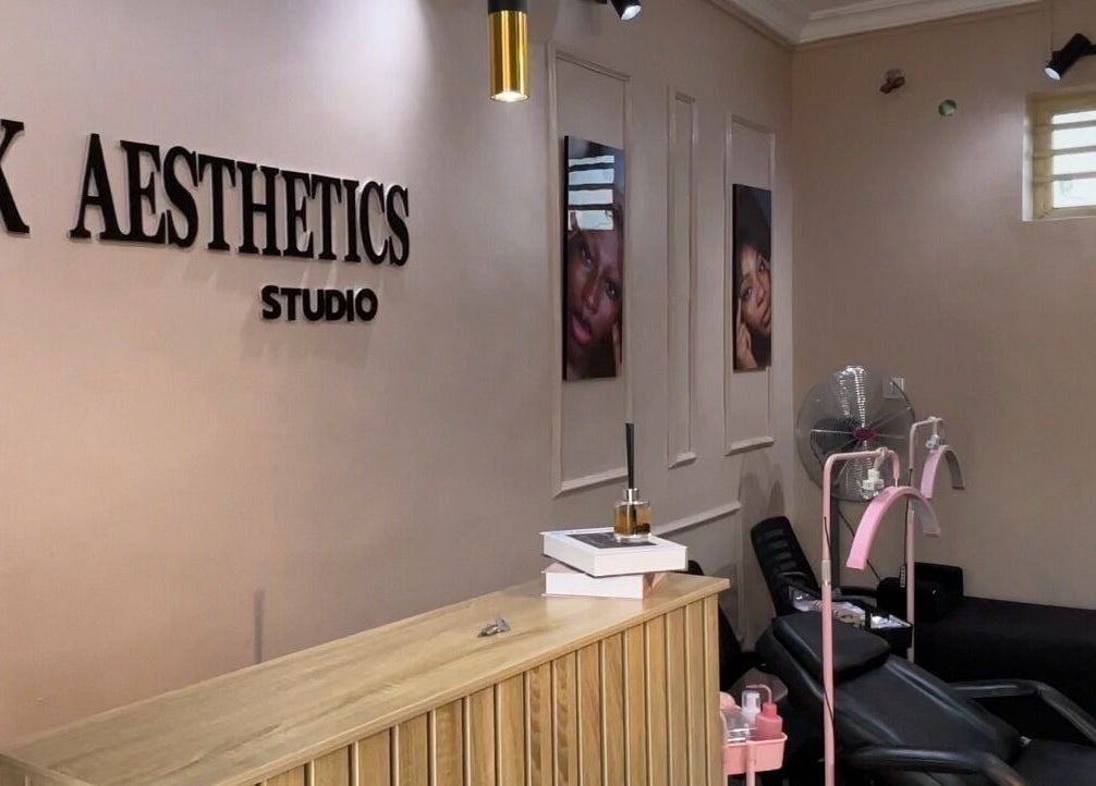 Inside NK Aesthetics, Ibadan, Oyo, NG showing a stylish reception and relaxing treatment chairs.
