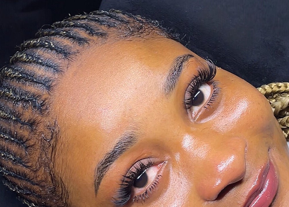 Client with glowing skin and braided hair at NK Aesthetics, Ibadan, Oyo, NG.