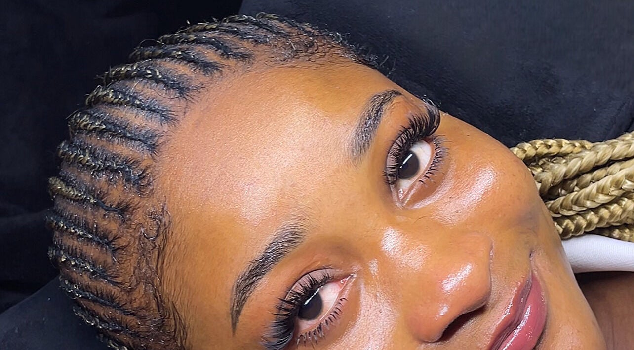 Client with glowing skin and braided hair at NK Aesthetics, Ibadan, Oyo, NG.