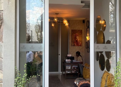 Entrance of Meraki Wellness Centre, Windhoek, Khomas Region, NA featuring elegant decor and warm lighting.