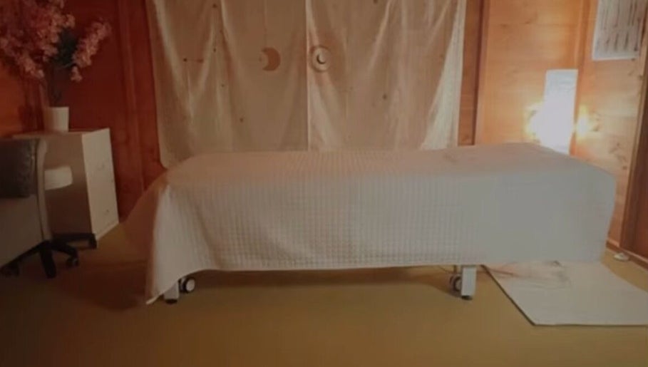 Tranquil therapy room at Xtremetherapeutics, Bootle, England, GB with a massage table and soft lighting.