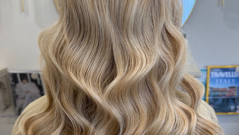 Elegant blonde waves styled at Gemma Mason Hair, Stockport, England, GB.