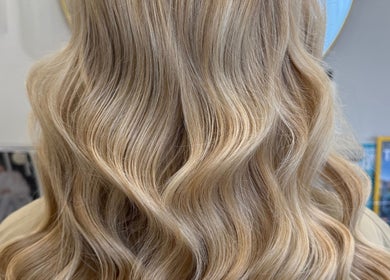 Elegant blonde waves styled at Gemma Mason Hair, Stockport, England, GB.
