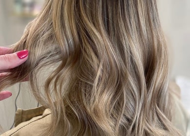 Blonde hair styled in soft waves at Gemma Mason Hair, Stockport, England, GB.