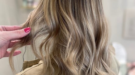 Blonde hair styled in soft waves at Gemma Mason Hair, Stockport, England, GB.