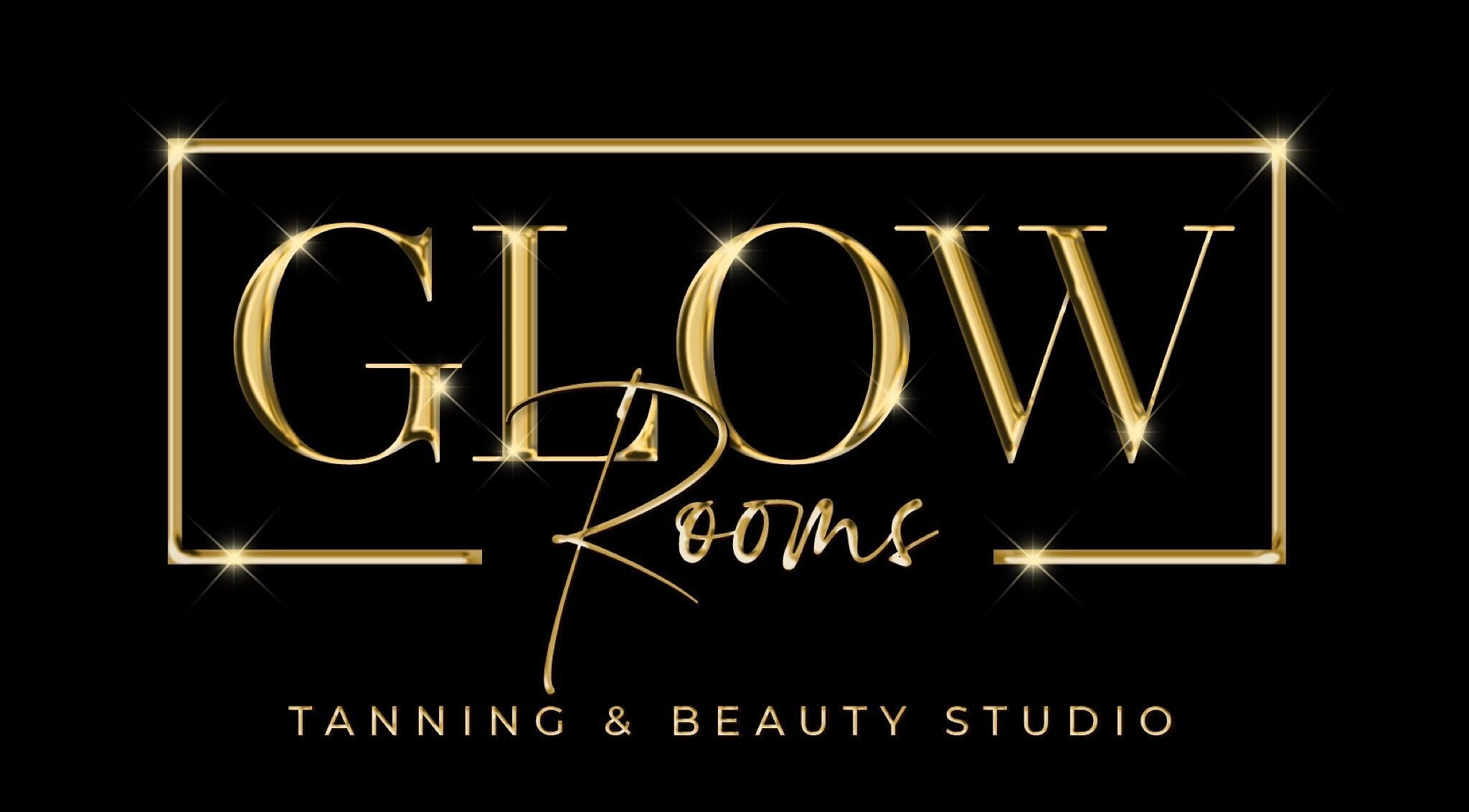 Elegant logo of Glow rooms Tanning and beauty studio in Lancaster, England, GB with a golden design on black.