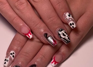 Unique nail art showcased at ClawsByCasey in Gateshead, England, GB. Black and white designs with red accents.