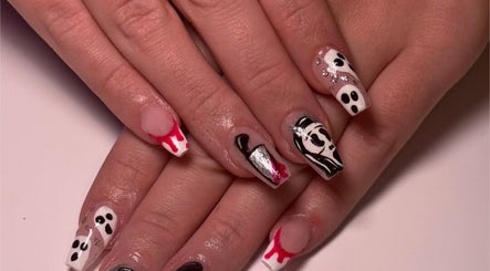 Unique nail art showcased at ClawsByCasey in Gateshead, England, GB. Black and white designs with red accents.