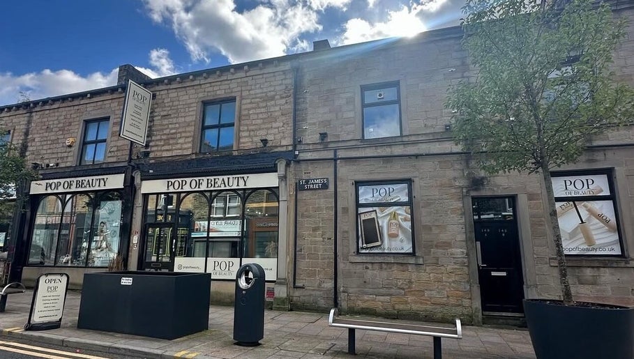 Gracella.beauty venue in Burnley, England, GB showcasing a welcoming stone facade under a clear sky.