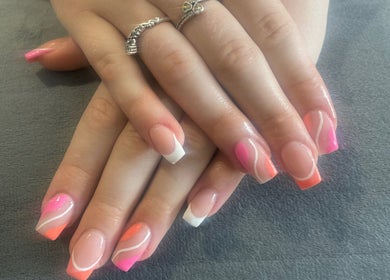 Colorful nail art at Gracella.beauty, Burnley, England, GB showcasing pink and white designs.