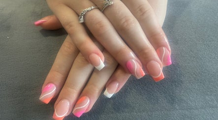 Colorful nail art at Gracella.beauty, Burnley, England, GB showcasing pink and white designs.