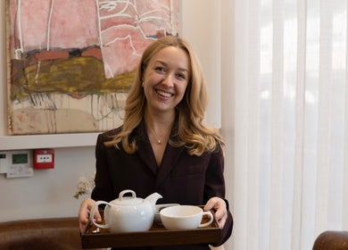 Friendly staff at Sakurami London serving tea, creating a cozy atmosphere in London, England, GB.