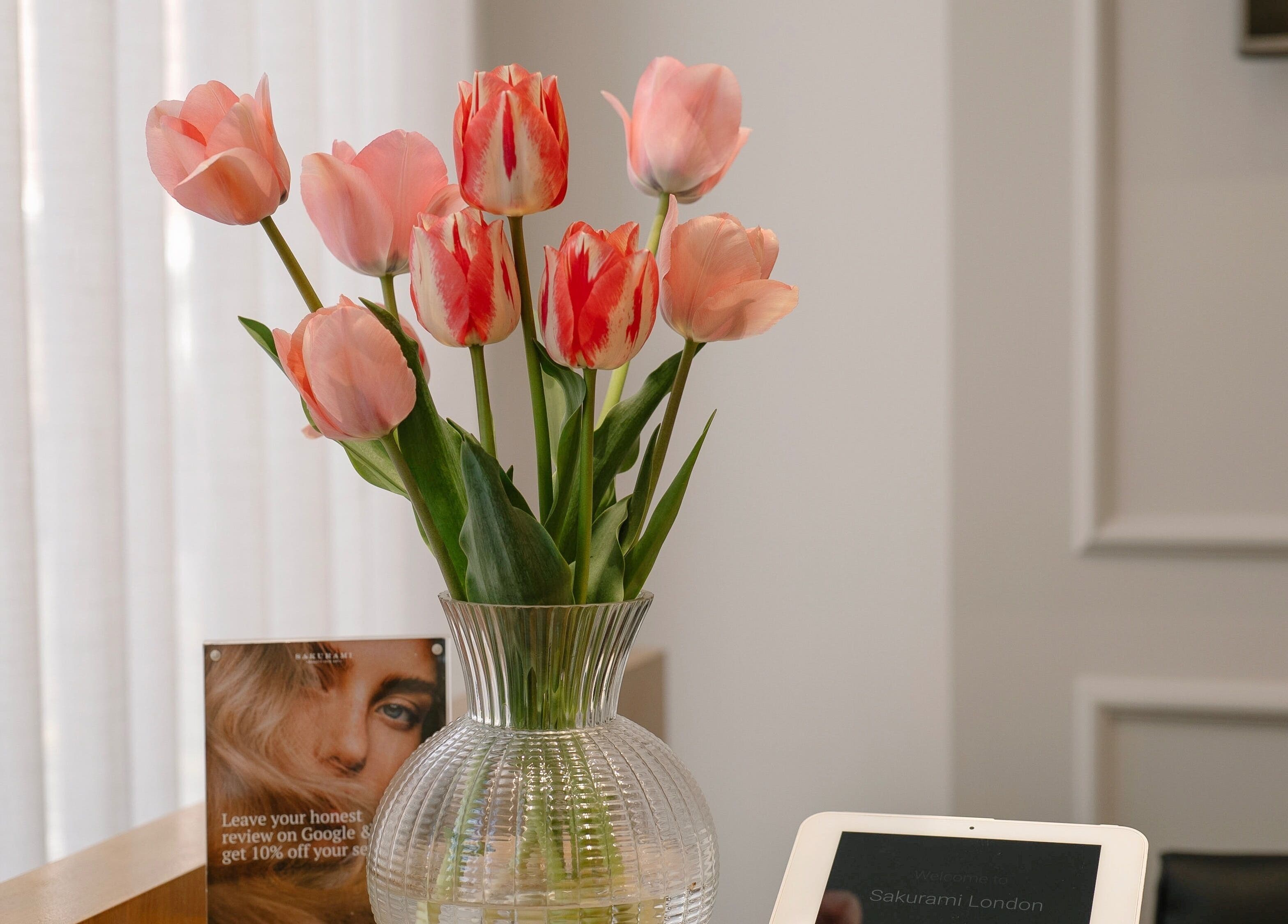 Vase of pink tulips at Sakurami London, enhancing the tranquil ambiance in London, England, GB.