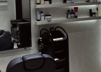 Sophisticated salon area at Velvet Rose Women Salon, Dubai, Dubai, AE featuring sleek chairs and product shelves.