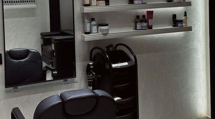 Sophisticated salon area at Velvet Rose Women Salon, Dubai, Dubai, AE featuring sleek chairs and product shelves.