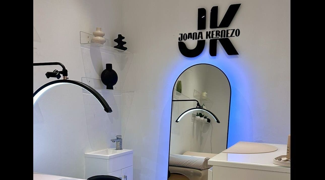 Chic interior of JK LASH & BROWS in London, England, GB, featuring modern decor with a stylish mirror.