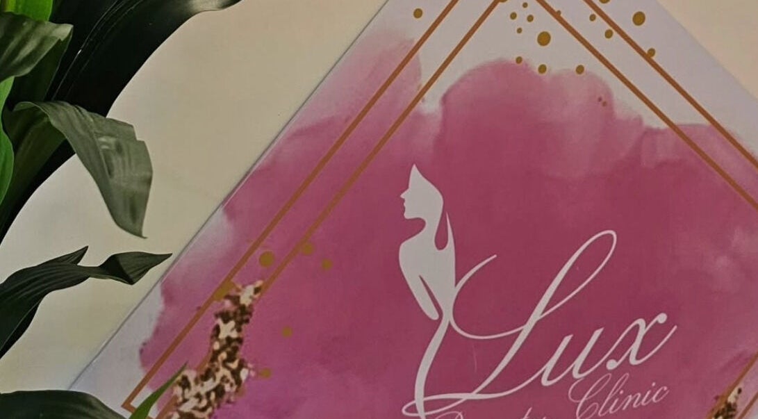 Lux Beauty Clinic logo with pink and gold accents in Paramaribo, Paramaribo, SR.