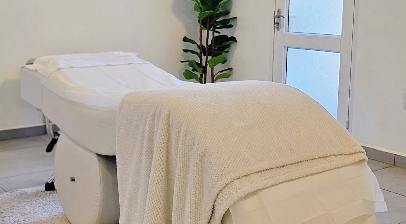 Cozy treatment room at Lux Beauty Clinic, Paramaribo, Paramaribo, SR, featuring a plush massage table.