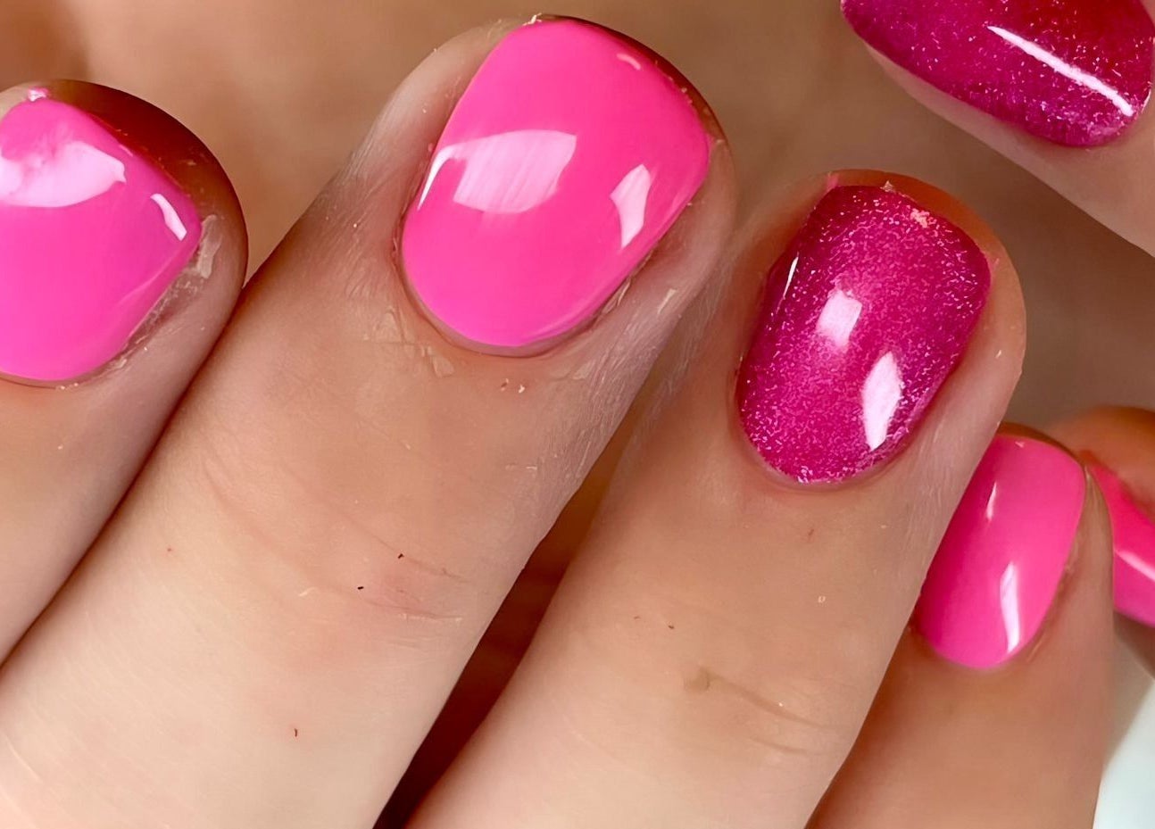 Bright pink nails showcasing artistic design at Sylwia Nails & Beauty, Cork, County Cork, IE.