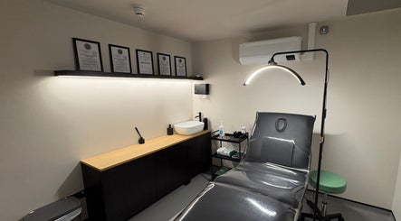 A modern treatment room at Kaesthetics Clinic in Dublin, County Dublin, IE with sleek furnishings and bright lighting.