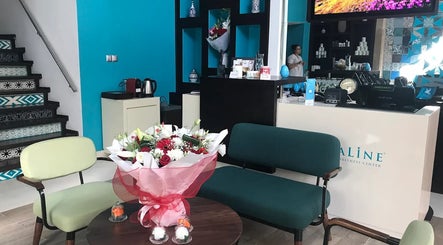 Elegant reception area at Aqualine Wellness Center, Marrakesh, Marrakesh-safi, MA with modern decor and floral arrangement.
